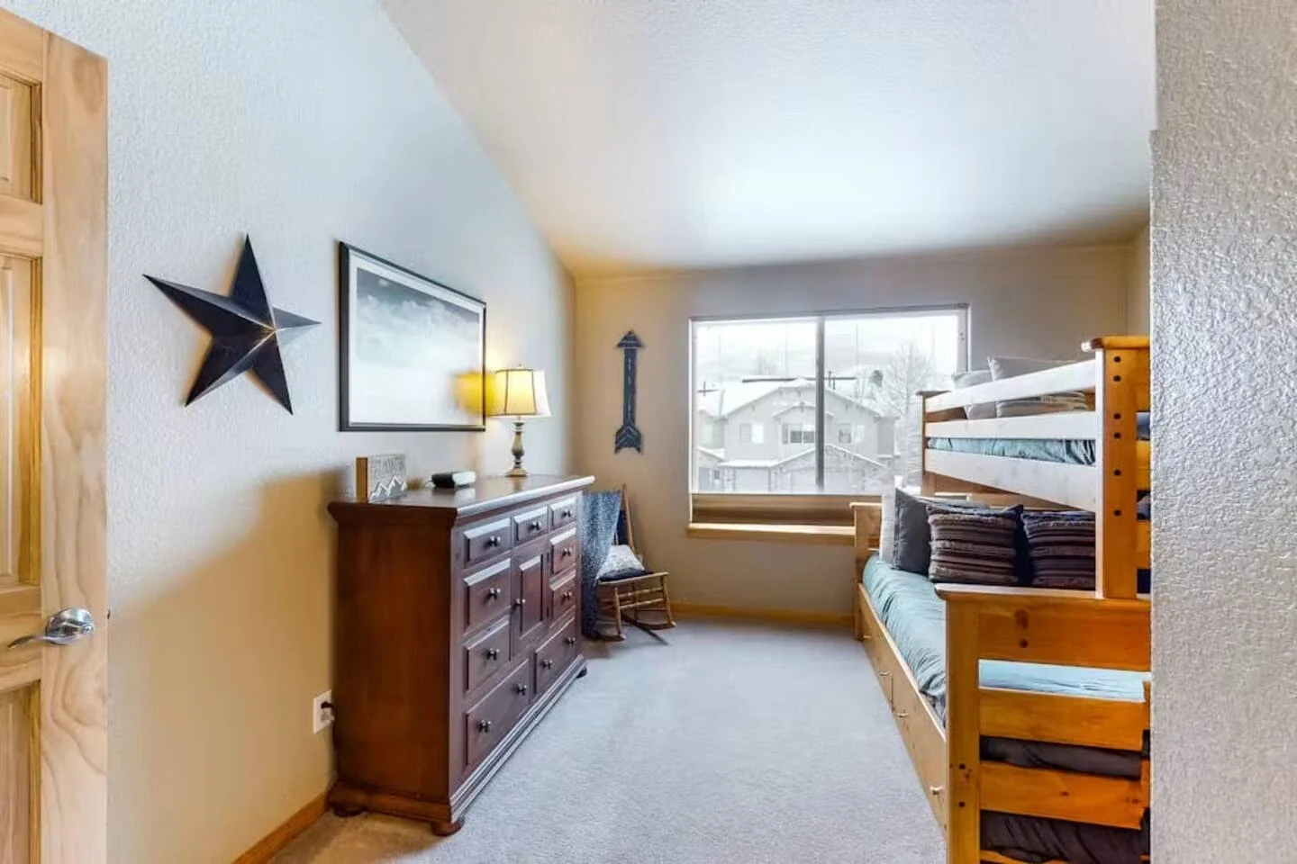 North Pond Retreat, Bunk bedroom with a wood dresser, star wall decoration, and window, waterfront vacation rental in Silverthorne, Colorado