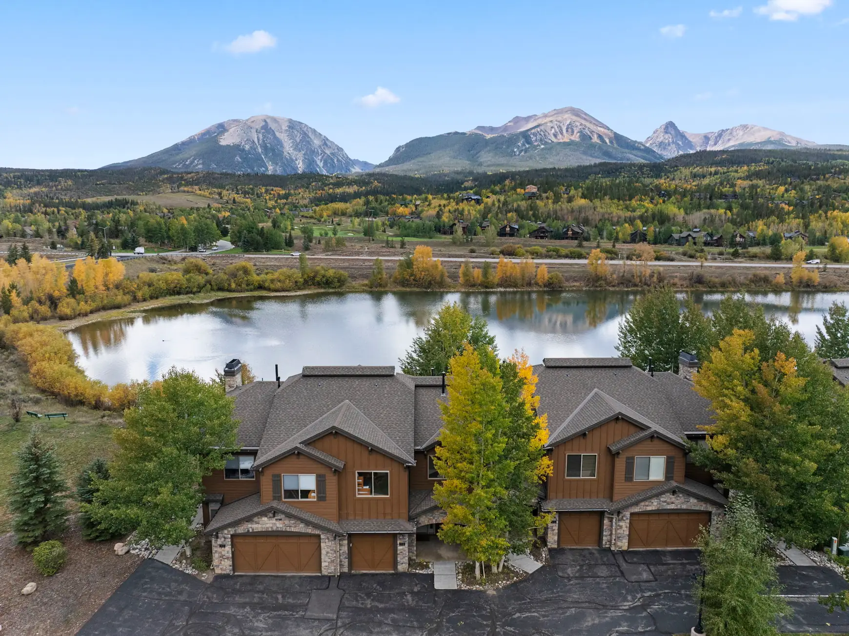 North Pond Retreat, Elevated view of the homes and garages with the pond and mountain peaks behind them, waterfront vacation rental in Silverthorne, Colorado