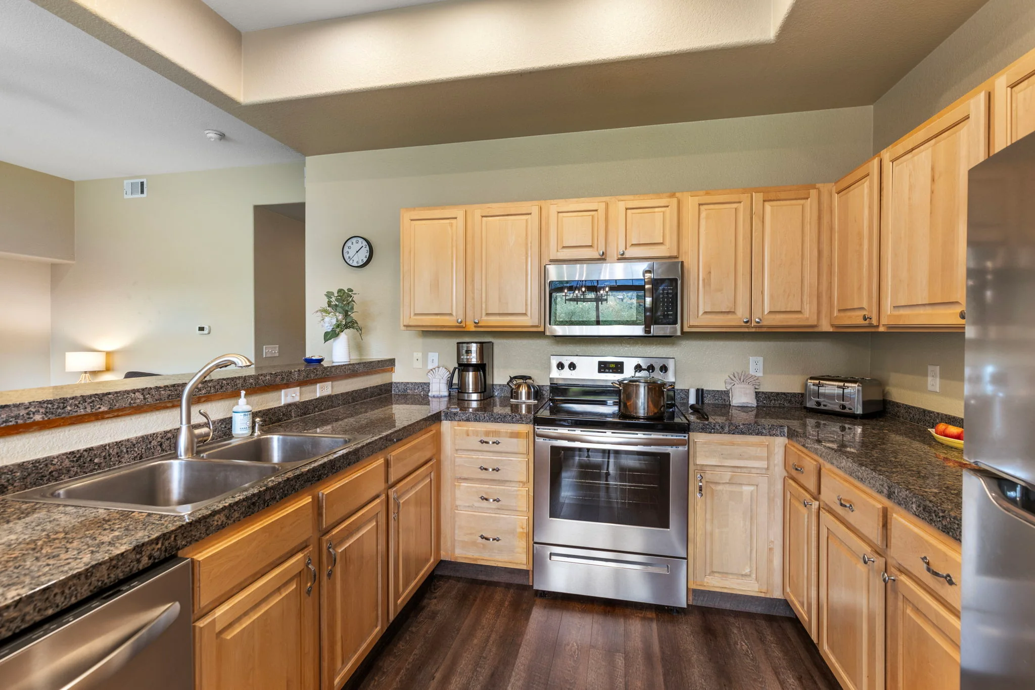 North Pond Retreat, Kitchen with wood cabinets, stainless appliances, a double sink, and dark countertops, waterfront vacation rental in Silverthorne, Colorado